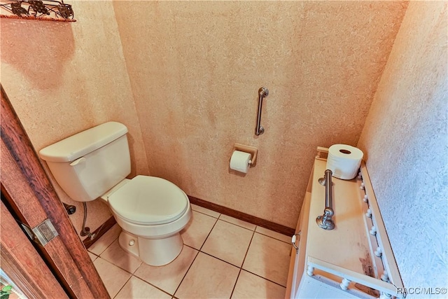 bathroom featuring tile patterned floors and toilet