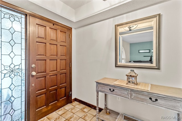 entrance foyer featuring light tile patterned floors