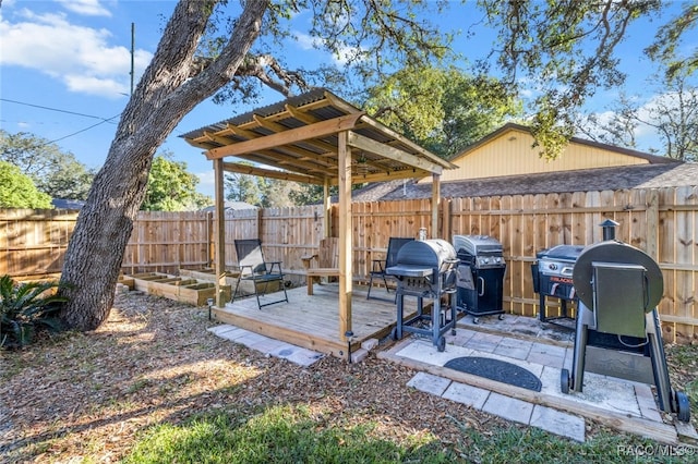 view of patio / terrace featuring a deck and grilling area