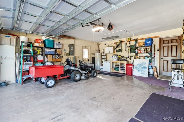 garage featuring electric panel and a garage door opener