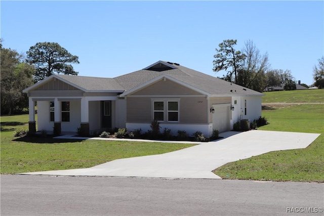 view of front facade featuring a garage, central AC, driveway, and a front lawn