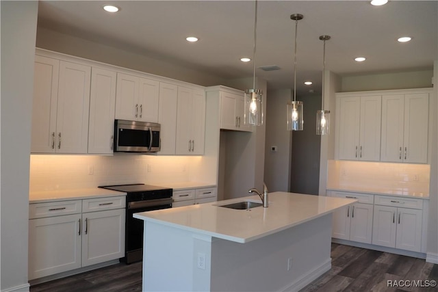 kitchen with black electric range, stainless steel microwave, dark wood-style flooring, and a sink