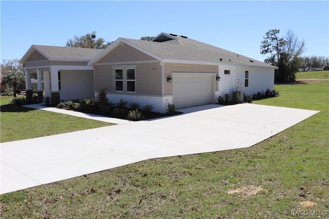 single story home with a garage, central AC unit, concrete driveway, a front lawn, and stucco siding