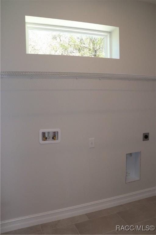 laundry area with baseboards, laundry area, washer hookup, and hookup for an electric dryer