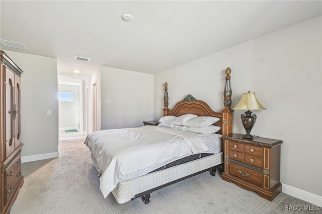 bedroom with light colored carpet