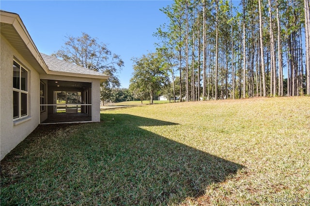 view of yard featuring a sunroom