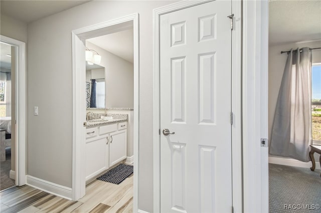 interior space featuring sink and light hardwood / wood-style floors