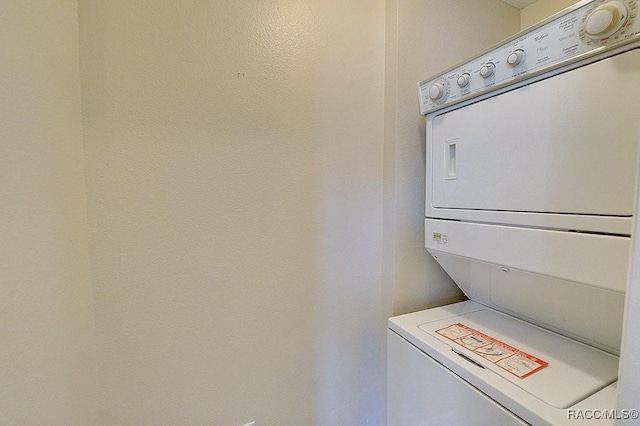 washroom with stacked washer and clothes dryer