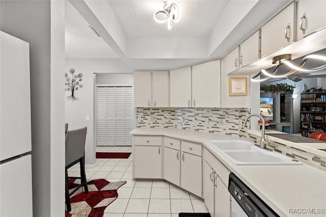 1631 N Dalary Pt, Crystal River, FL 34429 - kitchen with a sink, white appliances, light tile patterned floors, light countertops, and tasteful backsplash