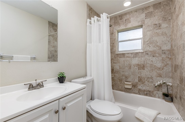 full bathroom with shower / tub combo, vanity, and toilet