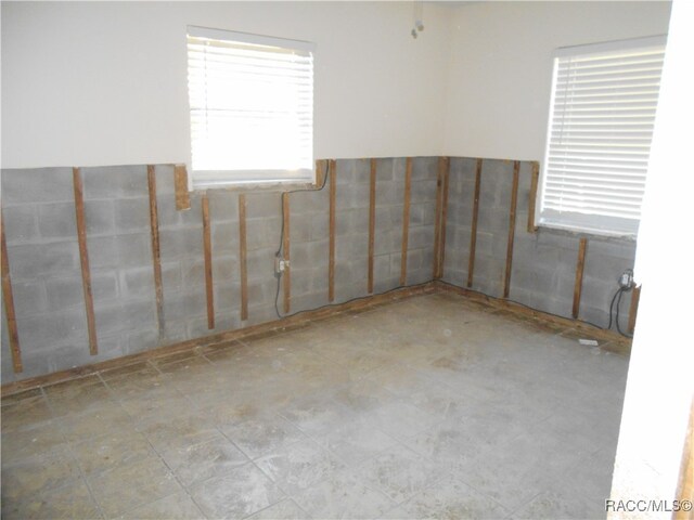 empty room with tile walls