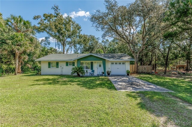 ranch-style house with a front yard and a garage