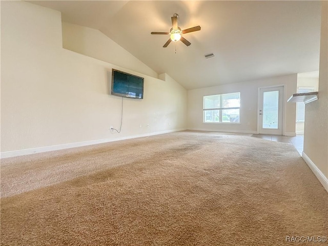 unfurnished living room with baseboards, visible vents, ceiling fan, carpet floors, and high vaulted ceiling