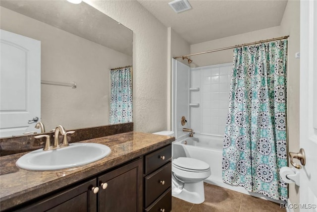 full bathroom with shower / bathtub combination with curtain, tile patterned flooring, vanity, a textured ceiling, and toilet