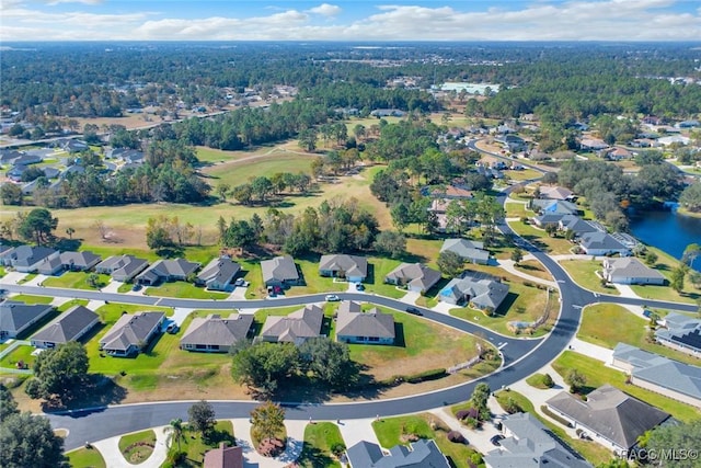 drone / aerial view featuring a water view and a residential view