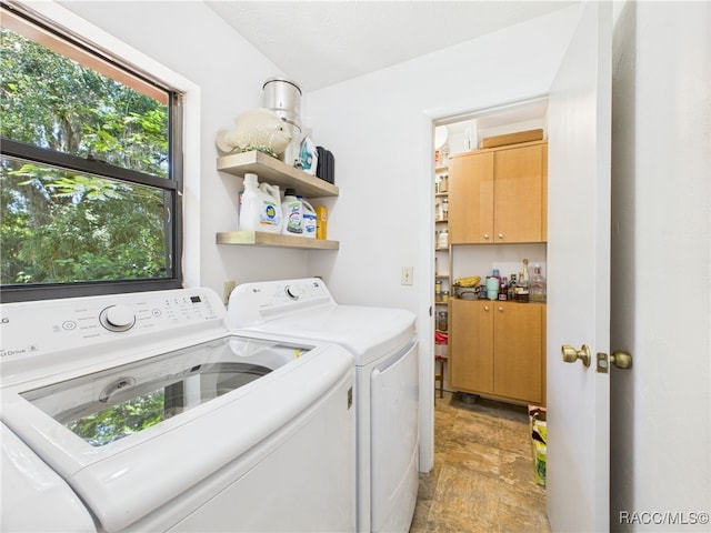 896 N Hollywood Cir, Crystal River, FL 34429 - laundry room featuring separate washer and dryer and stone finish floors