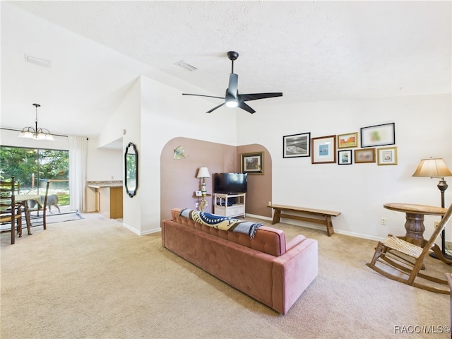 896 N Hollywood Cir, Crystal River, FL 34429 - living area with light carpet, a chandelier, baseboards, ceiling fan, and high vaulted ceiling
