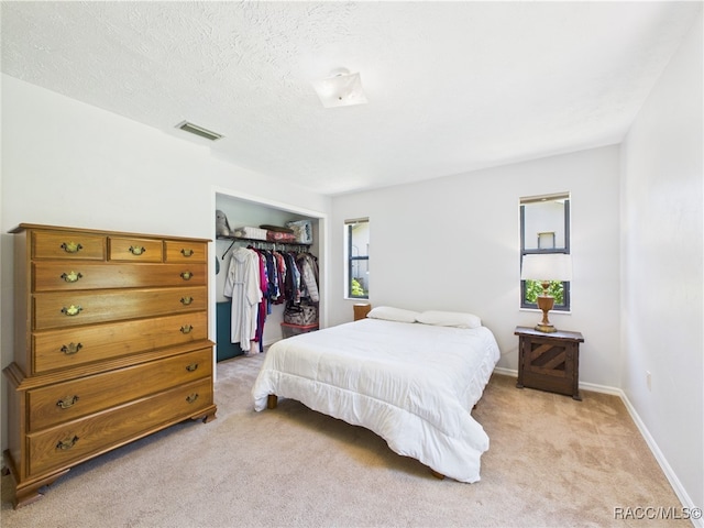 896 N Hollywood Cir, Crystal River, FL 34429 - bedroom with light carpet, a closet, and baseboards