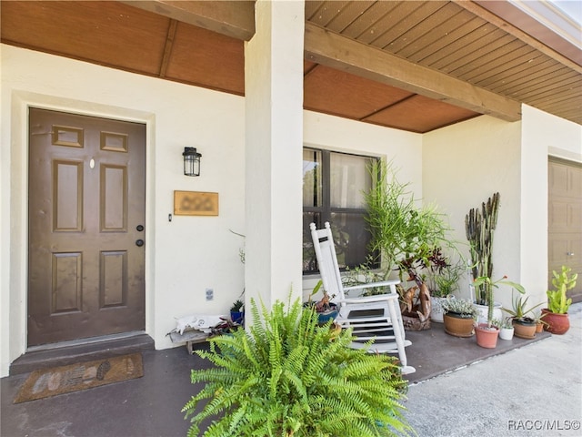 896 N Hollywood Cir, Crystal River, FL 34429 - property entrance featuring stucco siding and covered porch
