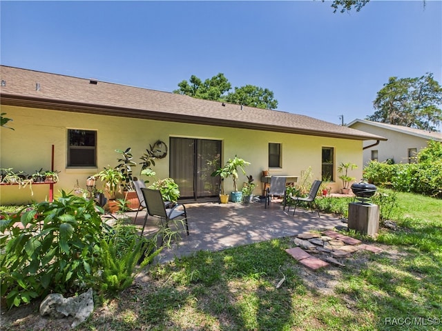 896 N Hollywood Cir, Crystal River, FL 34429 - back of house with a patio and stucco siding