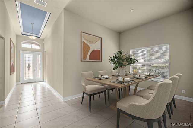 dining area with light tile patterned floors