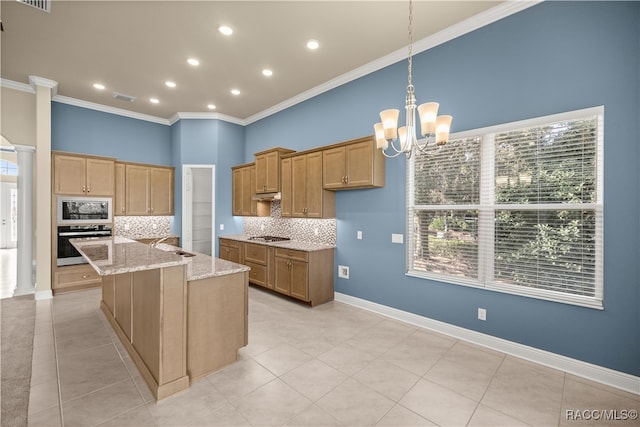 kitchen with light stone countertops, stainless steel oven, tasteful backsplash, a center island with sink, and white microwave