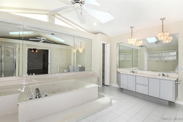 full bathroom with toilet, an inviting chandelier, vaulted ceiling with skylight, tile patterned flooring, and vanity