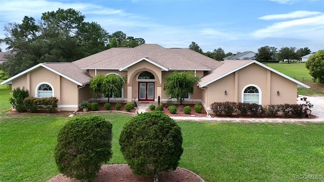 ranch-style home with a front lawn