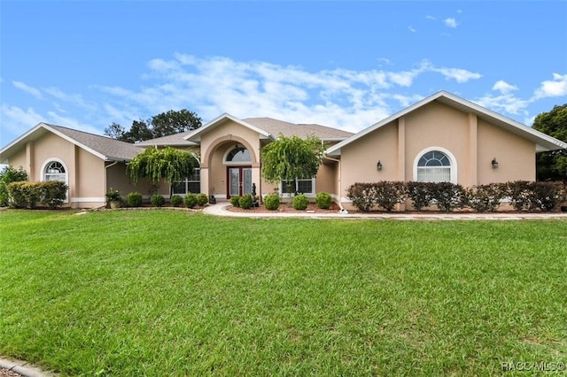 ranch-style house featuring a front yard