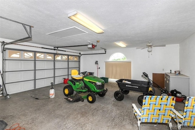 garage featuring a garage door opener and ceiling fan