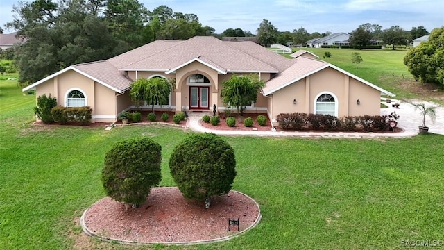 single story home with a front yard