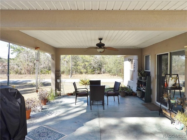 view of patio featuring a grill and ceiling fan