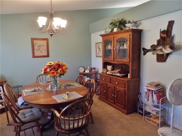 carpeted dining area with a notable chandelier