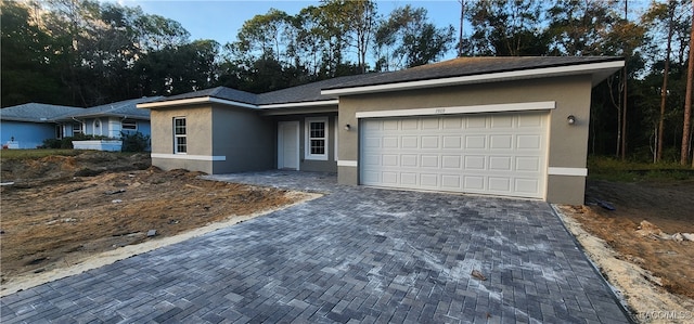 ranch-style home with a garage