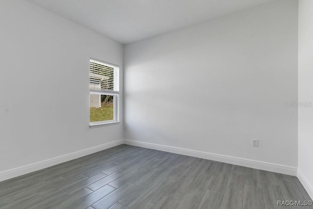 spare room featuring hardwood / wood-style floors