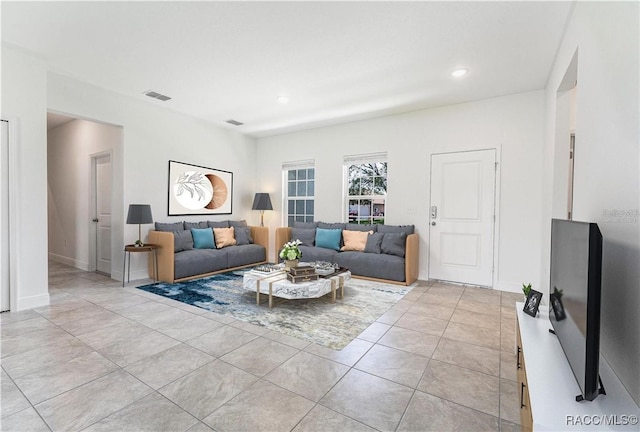 living room with light tile patterned floors