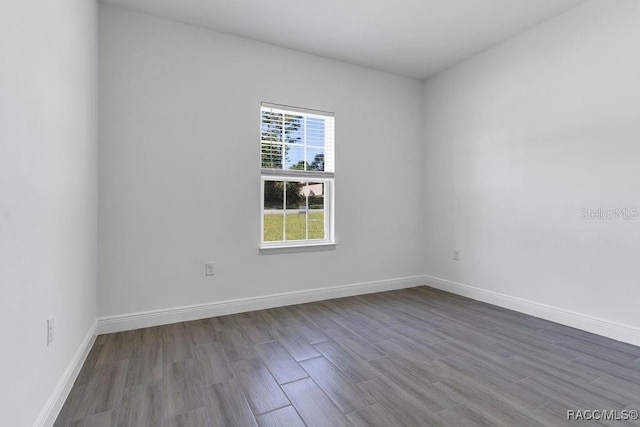 spare room featuring hardwood / wood-style flooring