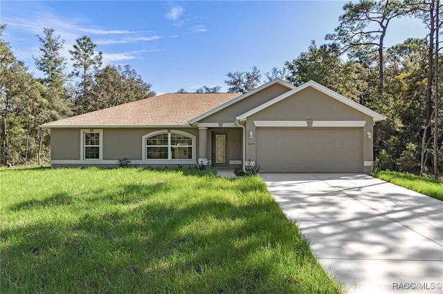 ranch-style house featuring a front yard and a garage