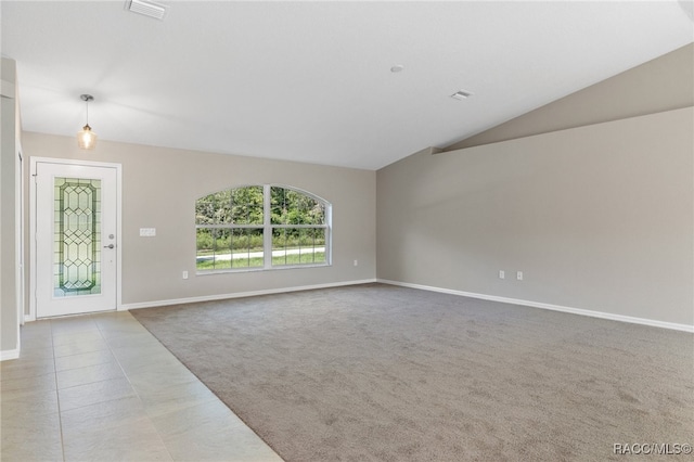 unfurnished living room featuring light carpet and lofted ceiling