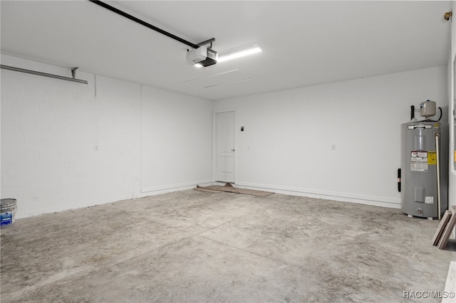 garage featuring water heater and a garage door opener