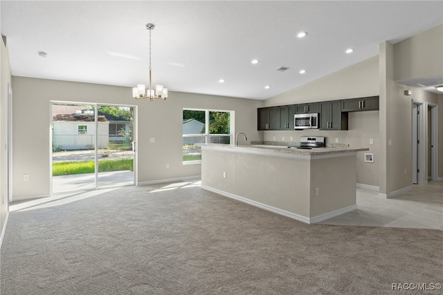 kitchen featuring light stone countertops, an inviting chandelier, pendant lighting, light carpet, and appliances with stainless steel finishes