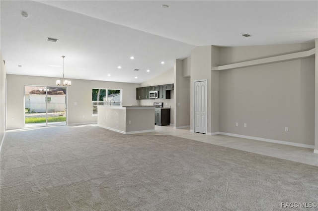 unfurnished living room with a notable chandelier, sink, light carpet, and high vaulted ceiling