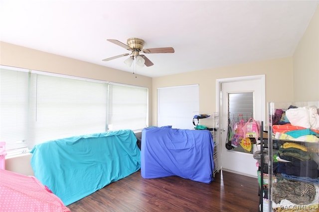 bedroom featuring ceiling fan and dark hardwood / wood-style flooring