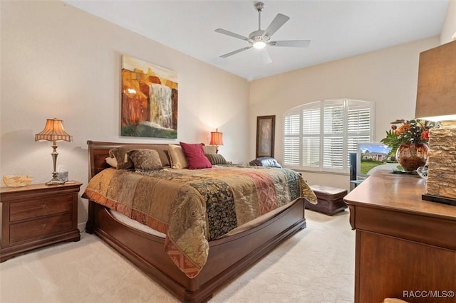 3915 N Grayhawk Loop, Lecanto, FL 34461 - bedroom with light carpet and a ceiling fan
