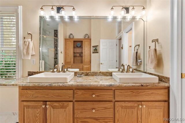 3915 N Grayhawk Loop, Lecanto, FL 34461 - full bath featuring a shower stall, double vanity, and healthy amount of natural light