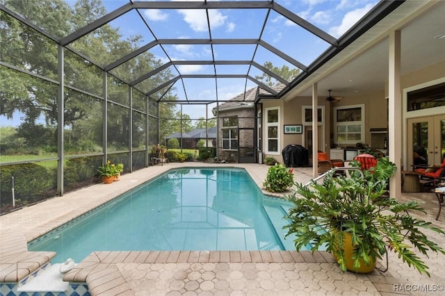 3915 N Grayhawk Loop, Lecanto, FL 34461 - outdoor pool with a ceiling fan, a patio area, grilling area, and glass enclosure
