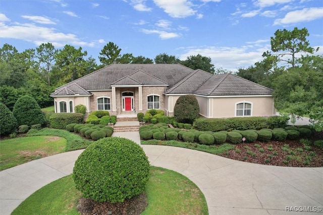3915 N Grayhawk Loop, Lecanto, FL 34461 - mediterranean / spanish-style house with stucco siding
