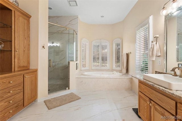 3915 N Grayhawk Loop, Lecanto, FL 34461 - bathroom with marble look tiles, a bath, a marble finish shower, and vanity
