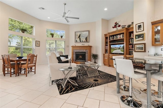 3915 N Grayhawk Loop, Lecanto, FL 34461 - living area featuring a lit fireplace, light tile patterned floors, a ceiling fan, and recessed lighting