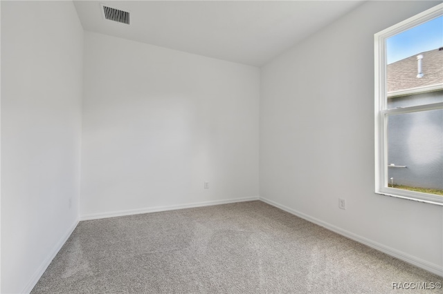 unfurnished room featuring carpet flooring